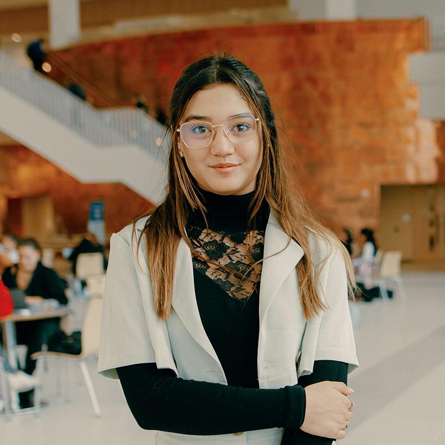 Valerie stands in lobby of Uhall.